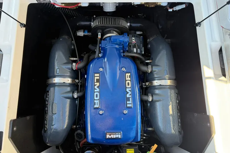 Slide: The Image of 2018 MasterCraft XT21 Ilmor engine, blue cover, powerful marine performance. - 17