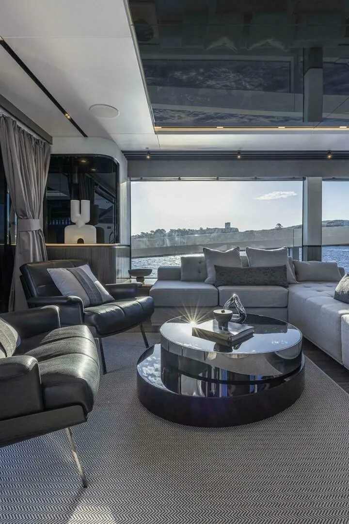 Slide: The Image of Luxurious interior of 2026 Pearl 82 yacht with modern seating and panoramic ocean view. - 13