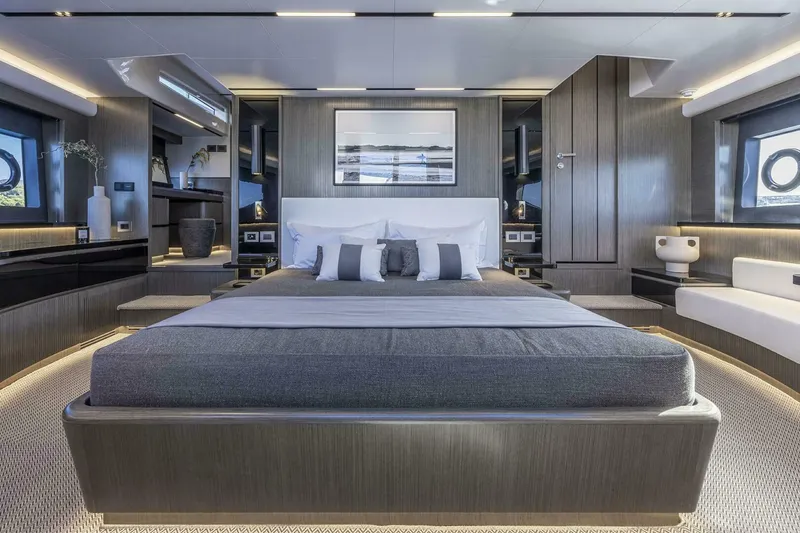 Slide: The Image of Luxurious bedroom interior on 2026 Pearl 82 yacht, featuring modern design and ambient lighting. - 24