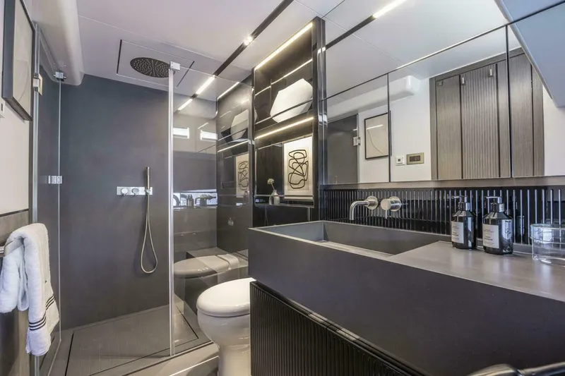 Slide: The Image of Modern bathroom interior in Pearl 82 yacht, 2026 model, featuring sleek design and luxury amenities. - 25