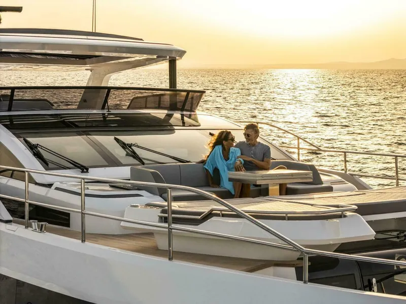 Slide: The Image of Couple enjoying sunset on Pearl 82 yacht, 2026 model, with ocean view. - 3