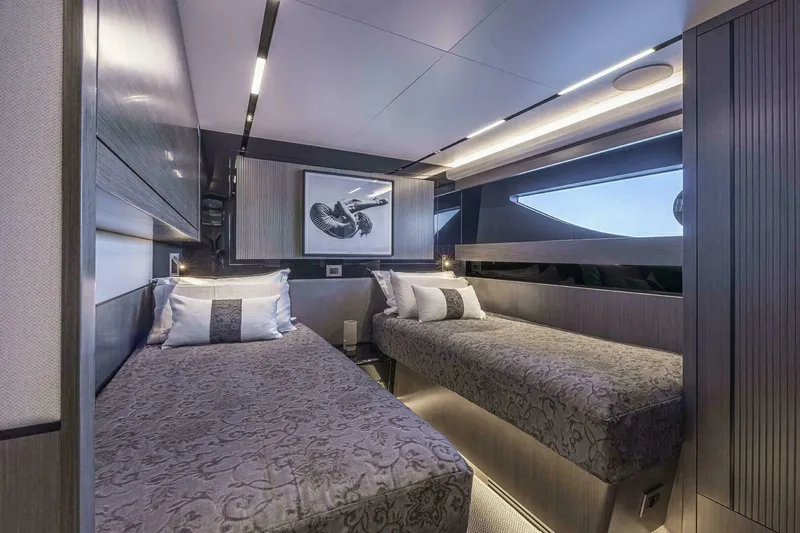 Slide: The Image of Luxurious cabin interior of 2026 Pearl 82 yacht with twin beds and modern decor. - 30