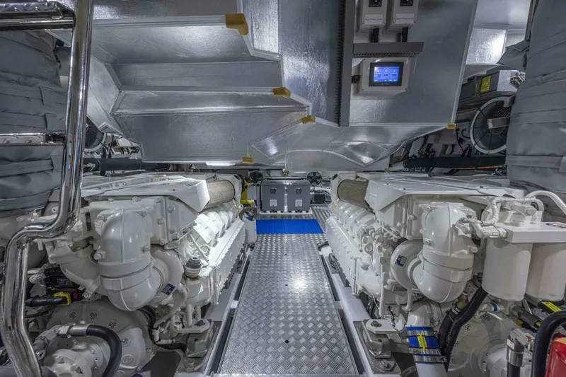 Slide: The Image of Engine room of 2026 Pearl 82 yacht, featuring dual engines and advanced control systems. - 36