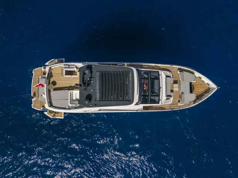 Slide: The Image of Aerial view of 2026 Pearl 82 yacht on deep blue ocean water. - 38