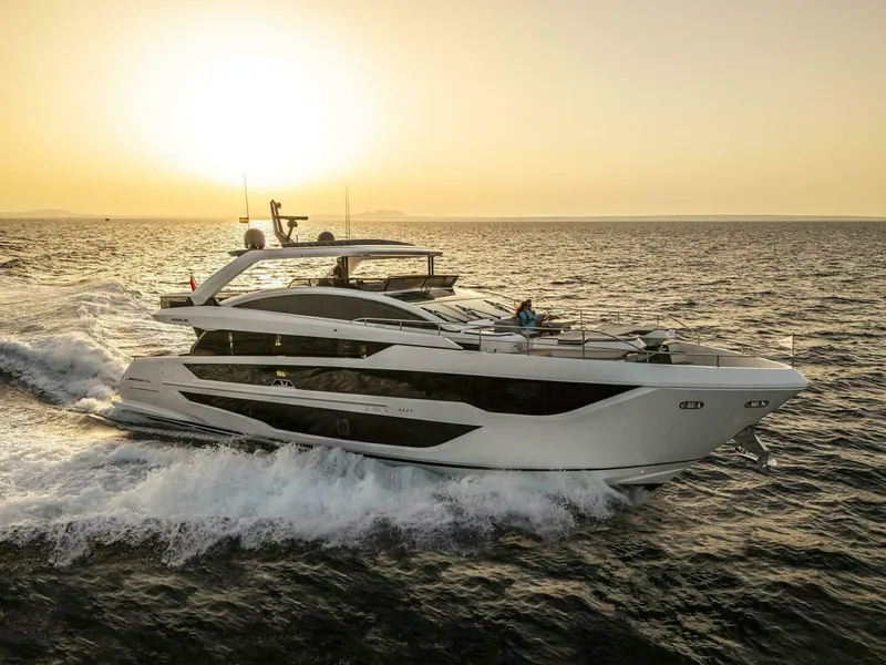 Slide: The Image of Luxurious 2026 Pearl 82 yacht cruising at sunset on open sea. - 39