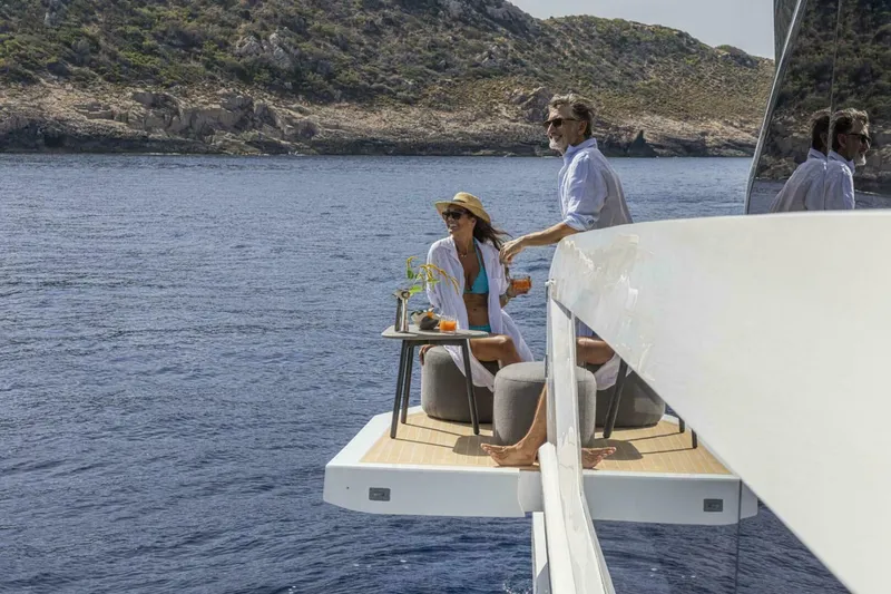 Slide: The Image of Couple relaxing on Pearl 82 yacht, enjoying ocean view, 2026 model. - 40