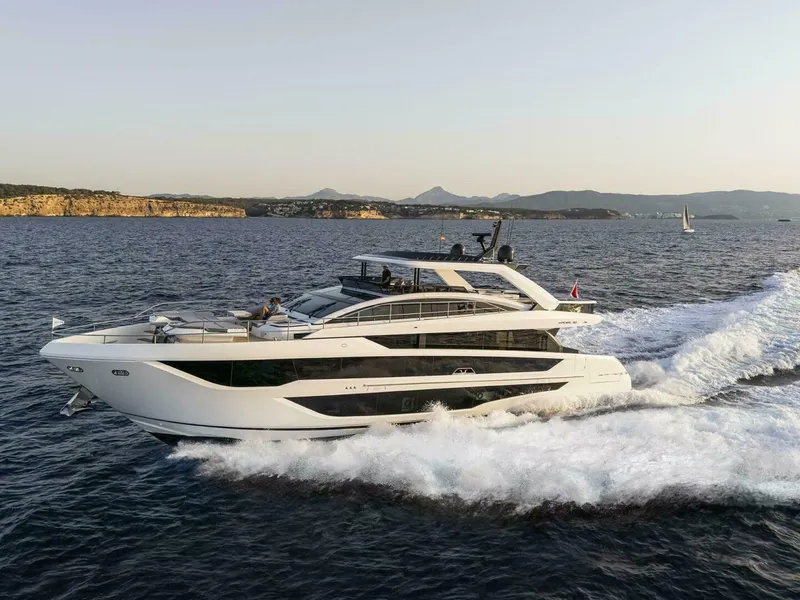 Slide: The Image of Luxurious 2026 Pearl 82 yacht cruising on open sea with scenic coastline backdrop. - 41