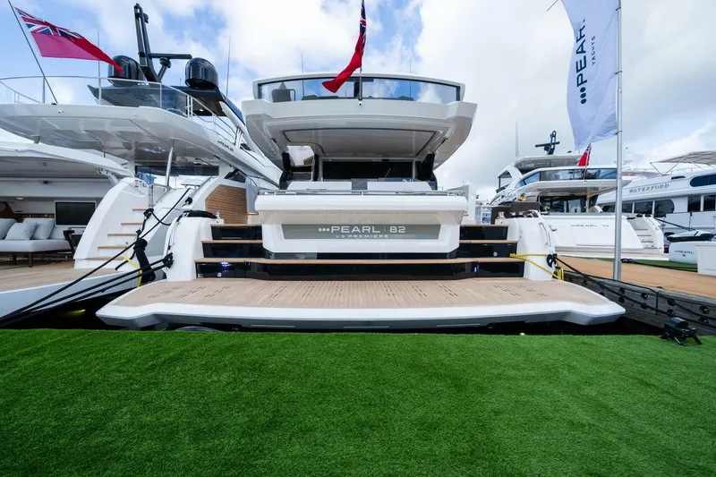 Slide: The Image of Luxury Pearl 82 yacht docked, showcasing sleek design and modern features, 2026 model. - 43