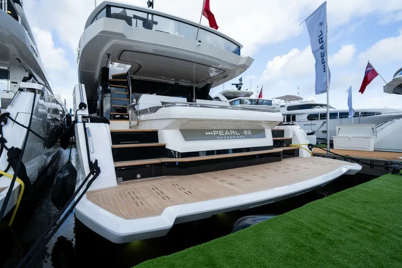 Slide: The Image of Luxury Pearl 82 yacht docked, showcasing sleek design and spacious deck, 2026 model. - 44