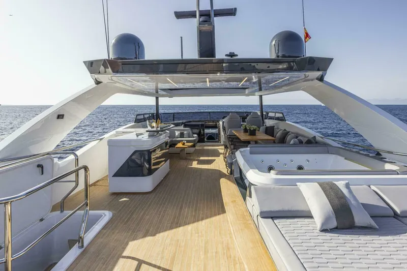 Slide: The Image of Luxurious Pearl 82 yacht deck with jacuzzi, lounge, and ocean view, 2026 model. - 8