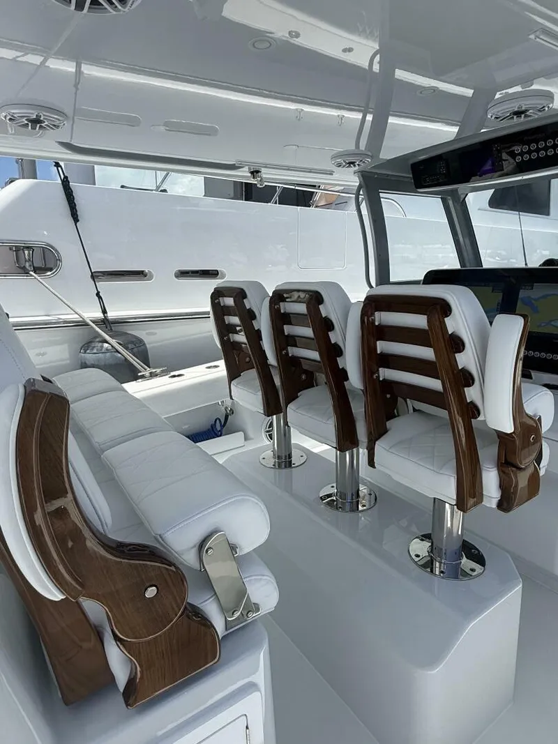 Slide: The Image of Luxurious interior of 2026 Freeman 38 boat with elegant white seating and wood accents. - 14