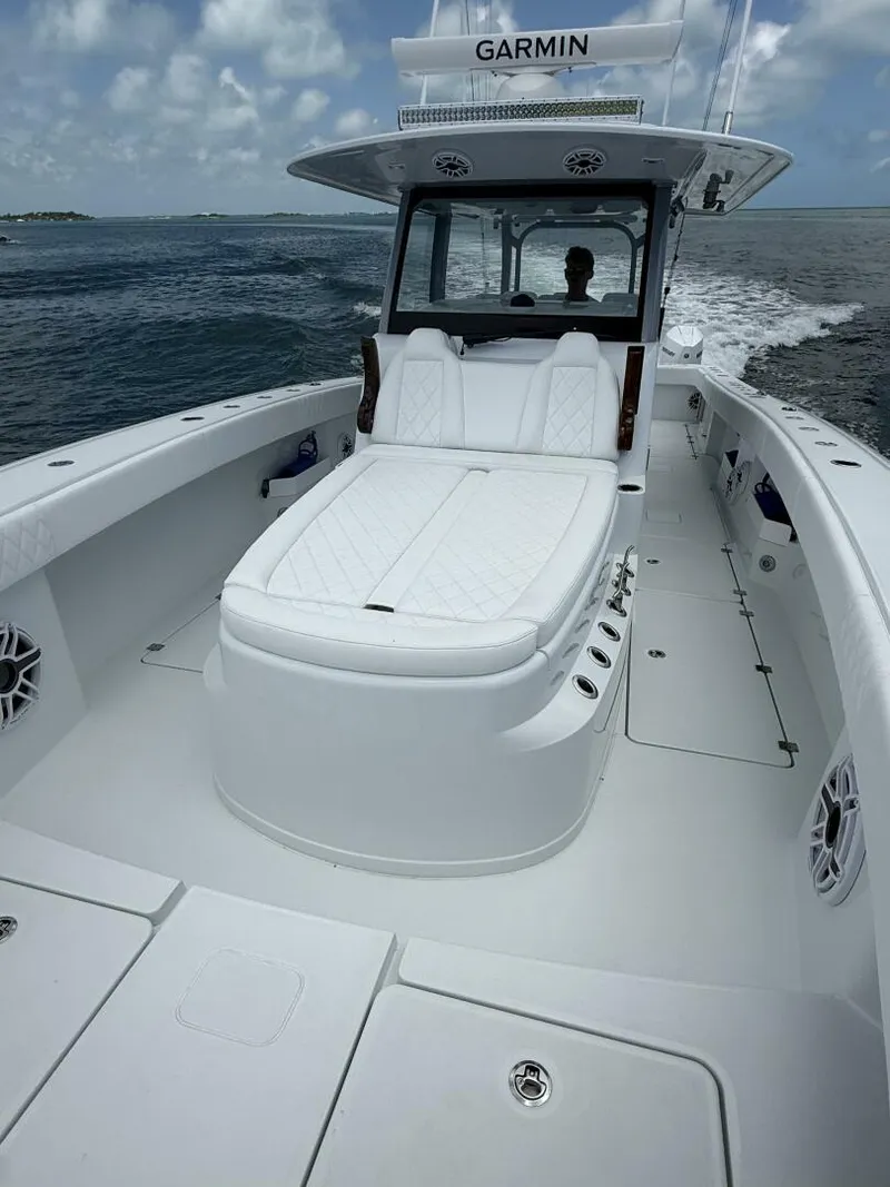 Slide: The Image of 2026 Freeman 38 boat with white seating, Garmin equipment, cruising on open water. - 17