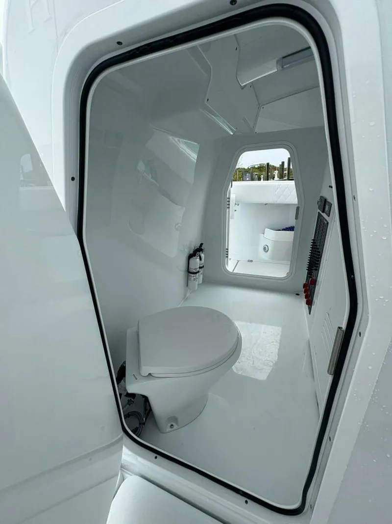 Slide: The Image of Interior view of Freeman 38 boat bathroom, featuring a modern toilet and sleek design, 2026 model. - 22
