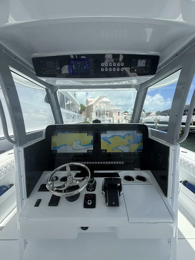 Slide: The Image of Modern Freeman 38 boat cockpit with dual navigation screens, steering wheel, and controls, 2026 model. - 7