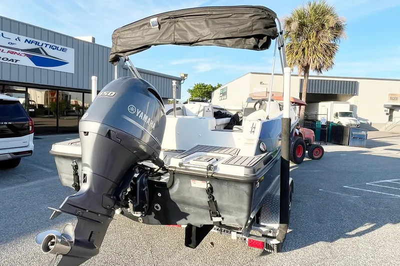Slide: The Image of 2022 Starcraft SVX 191 OB boat with Yamaha outboard motor, parked outdoors. - 3