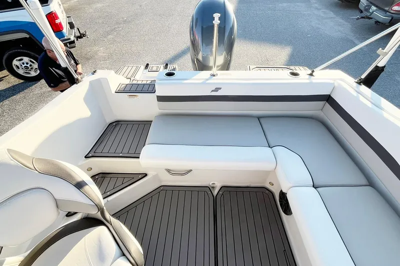 Slide: The Image of 2022 Starcraft SVX 191 OB boat interior with cushioned seating and sleek design. - 7