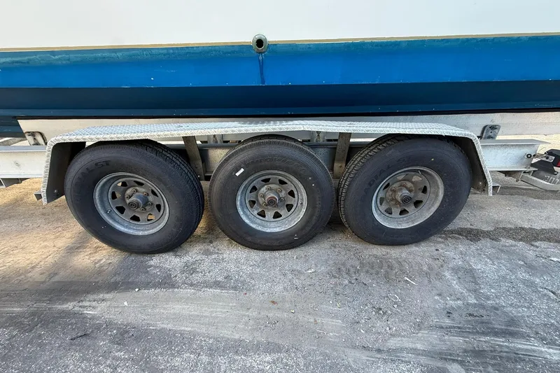 Slide: The Image of Triple-axle trailer for 1998 Contender 35 Express boat, side view. - 102