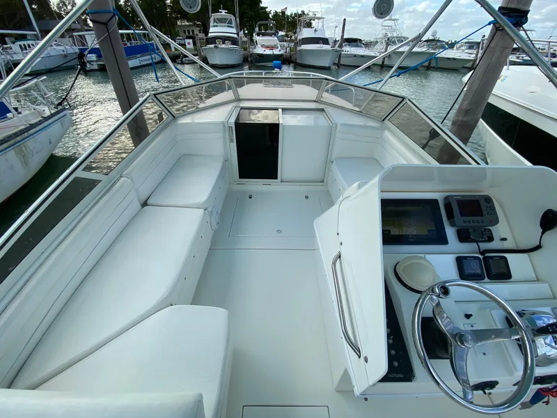 Slide: The Image of Control panel on a 1998 Contender 35 Express boat, featuring multiple switches. - 24