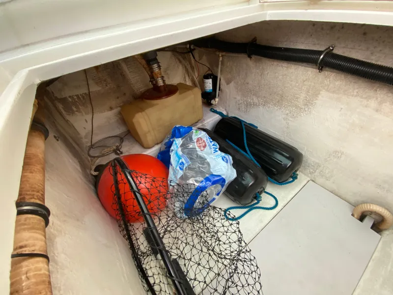 Slide: The Image of VHF marine radio on 1998 Contender 35 Express boat, displaying channel 16 and coordinates. - 28