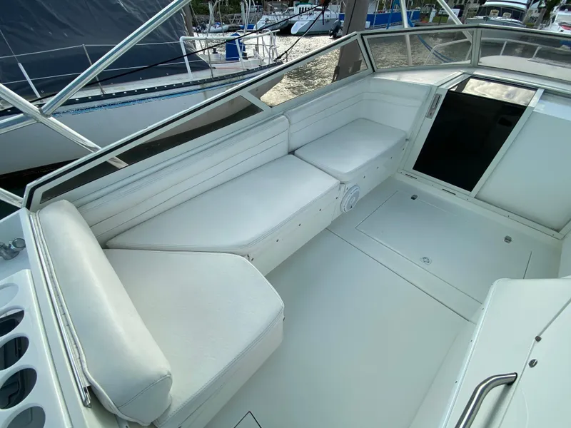 Slide: The Image of Control panel of a 1998 Contender 35 Express boat with Suzuki instruments. - 30