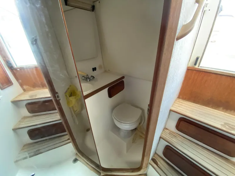 Slide: The Image of 1998 Contender 35 Express boat interior with seating, docked at marina. - 43