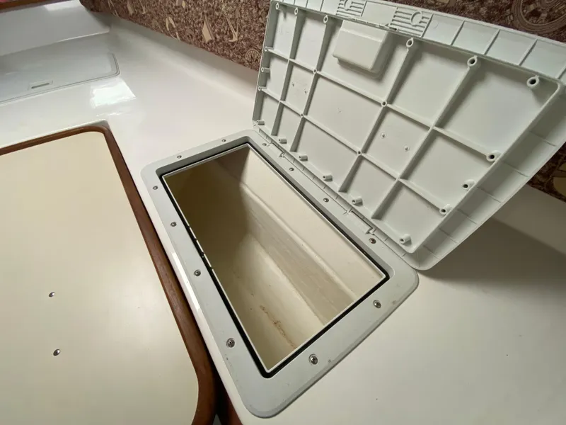 Slide: The Image of Interior of 1998 Contender 35 Express boat with wooden steps and compact kitchen area. - 50