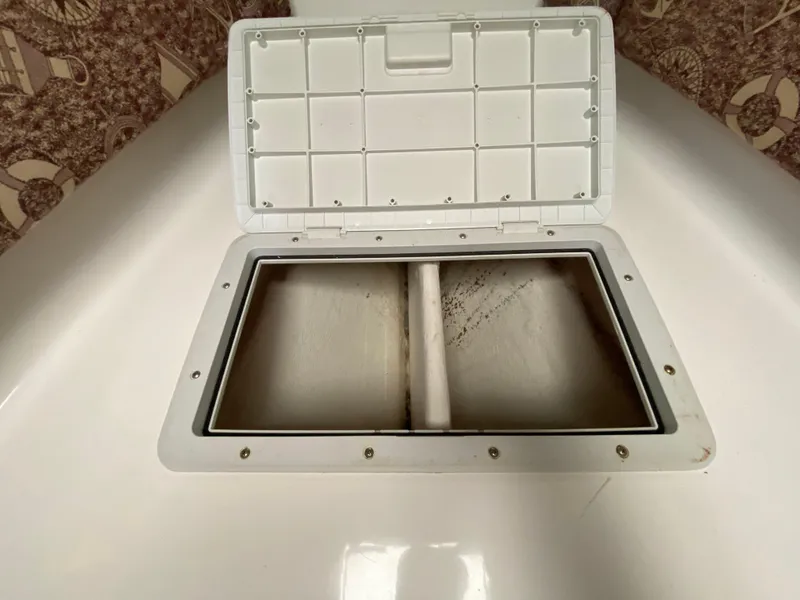 Slide: The Image of 1998 Contender 35 Express boat bathroom with sink and toilet. - 51