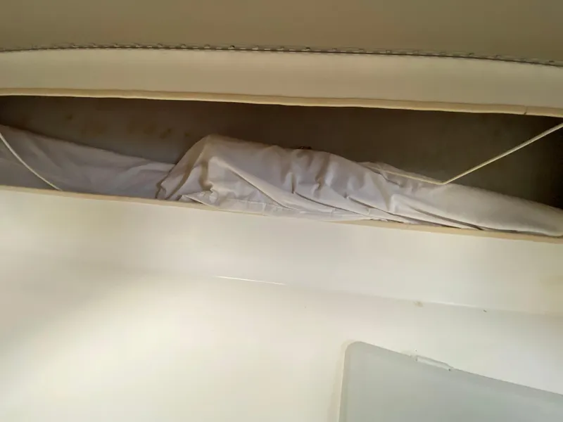 Slide: The Image of 1998 Contender 35 Express boat bathroom with sink and toilet. - 52