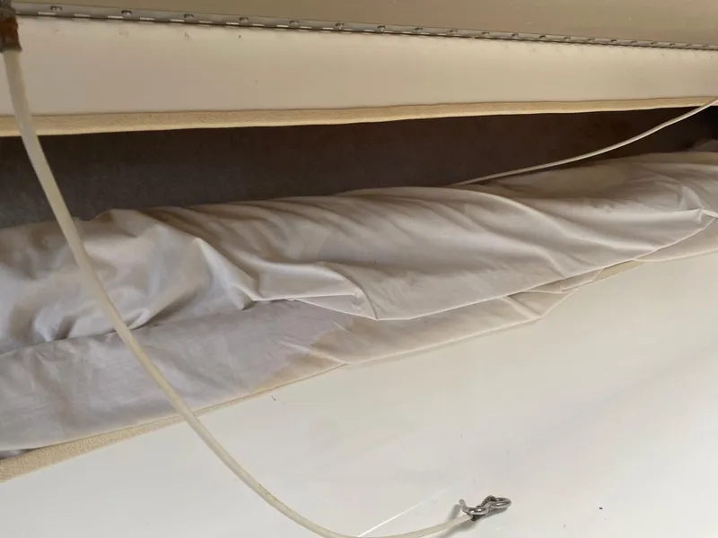 Slide: The Image of 1998 Contender 35 Express boat bathroom with sink, mirror, and storage. - 53