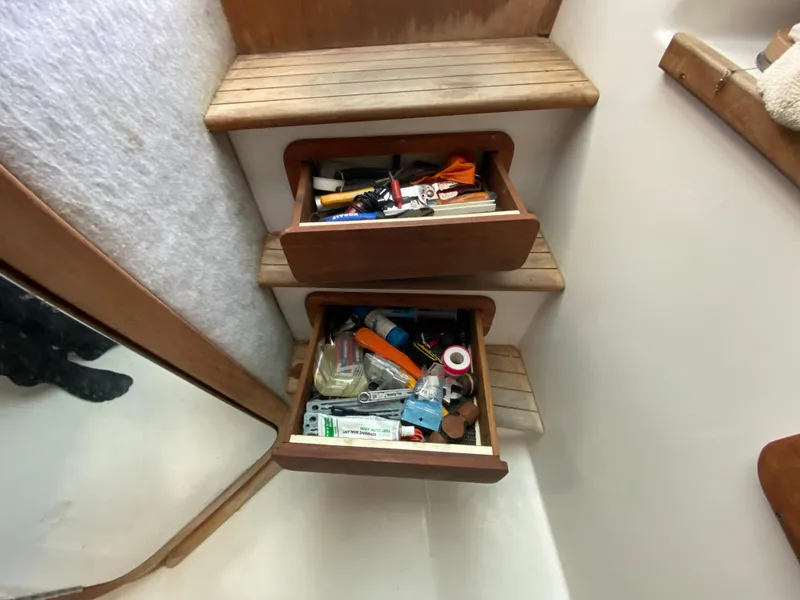 Slide: The Image of Open storage compartment on 1998 Contender 35 Express boat. - 57