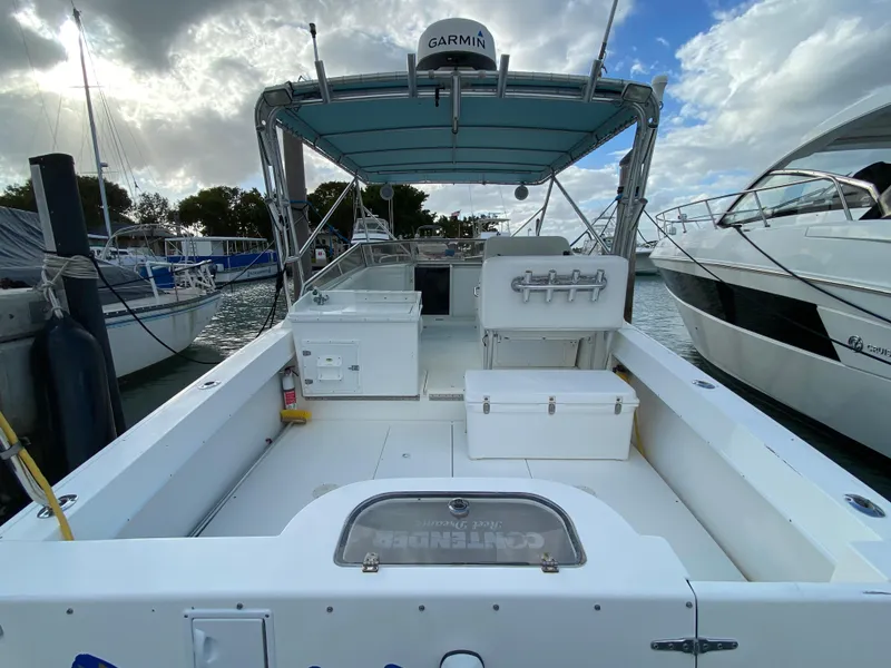 Slide: The Image of 1998 Contender 35 Express boat docked, featuring "Reel Dreamz" signage, Key Colony Beach, FL. - 6
