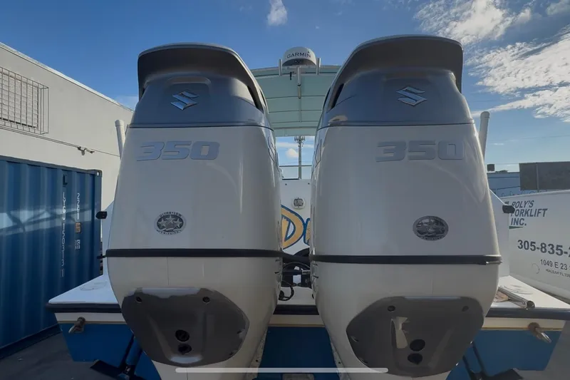 Slide: The Image of Twin Suzuki 350 outboard engines on a 1998 Contender 35 Express boat. - 92