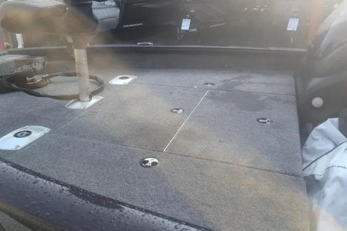 Slide: The Image of 2022 Tracker Pro Team 175 TF boat interior with seating and storage compartments. - 4