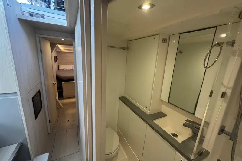Slide: The Image of Interior of 2021 Leopard 45 yacht showing bathroom and bedroom corridor. - 117
