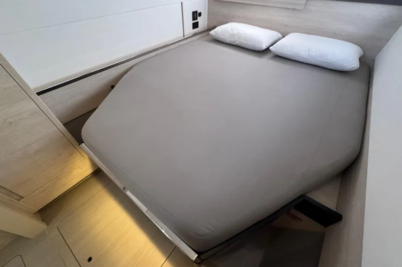 Slide: The Image of Modern bedroom interior on 2021 Leopard 45 yacht with double bed and pillows. - 118