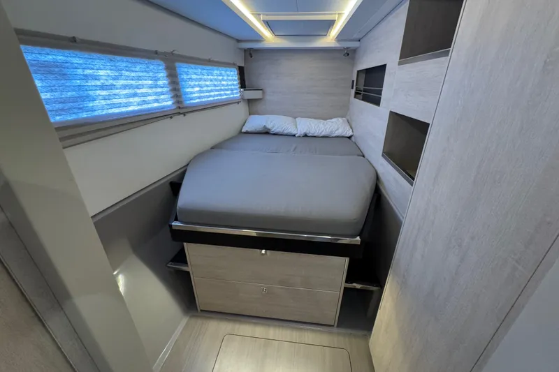 Slide: The Image of Modern bedroom interior in a 2021 Leopard 45 yacht, featuring a cozy bed and sleek design. - 124