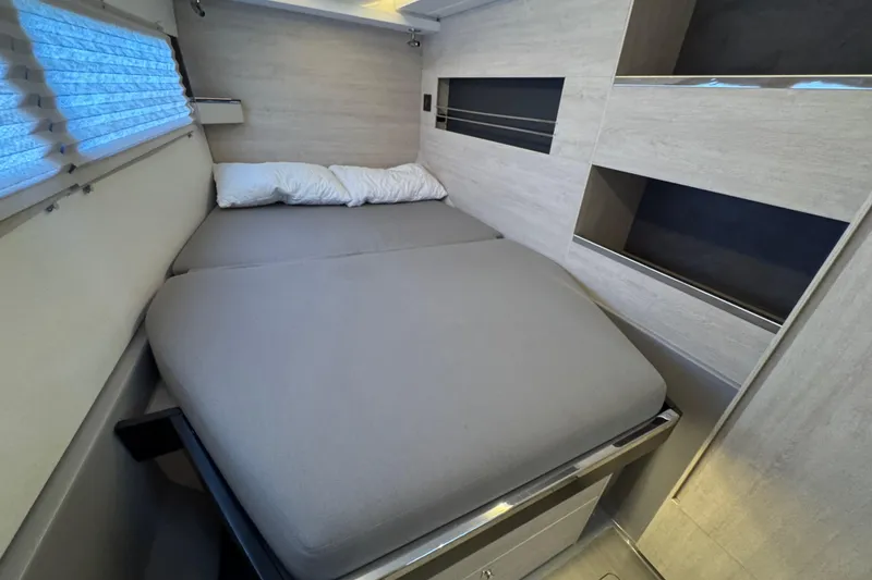 Slide: The Image of Cozy bedroom interior in 2021 Leopard 45 catamaran with modern design and comfortable bedding. - 128