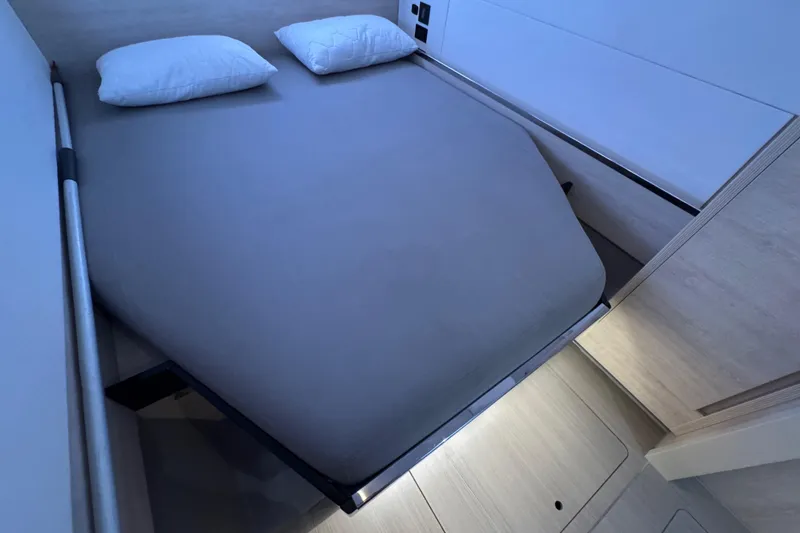Slide: The Image of Modern bedroom interior on 2021 Leopard 45 yacht, featuring a neatly made bed. - 134