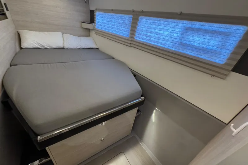 Slide: The Image of Cozy bedroom in 2021 Leopard 45 catamaran with modern design and soft lighting. - 136