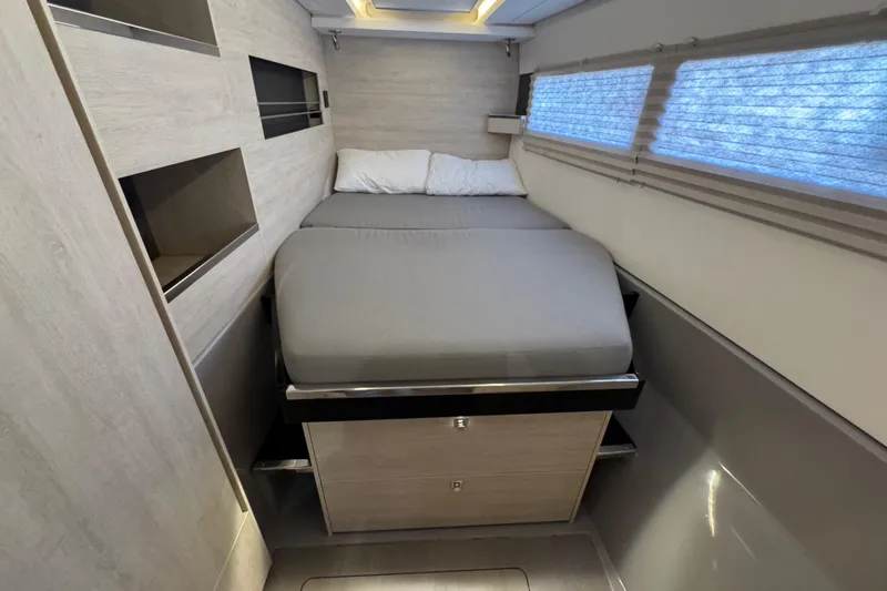 Slide: The Image of Interior cabin of 2021 Leopard 45 yacht with modern bed and storage. - 145