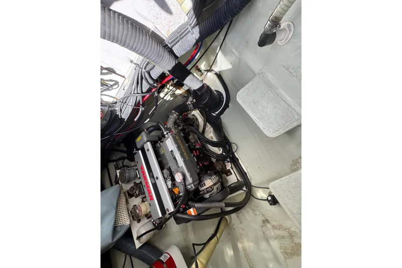 Slide: The Image of Engine compartment of a 2021 Leopard 45 yacht, featuring a Yanmar engine. - 147