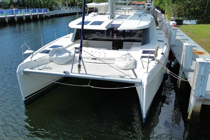 Slide: The Image of 2021 Leopard 45 catamaran docked in a serene marina setting. - 20