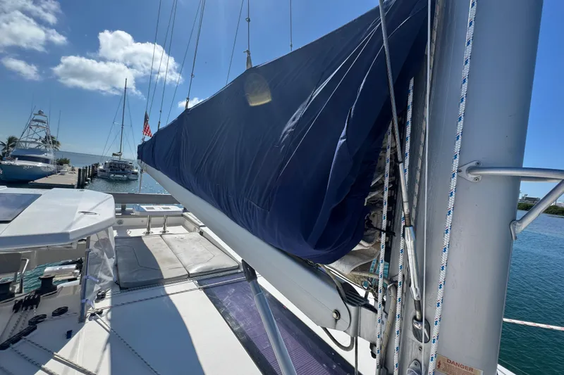 Slide: The Image of 2021 Leopard 45 catamaran docked with inflatable dinghy and outboard motor. - 24