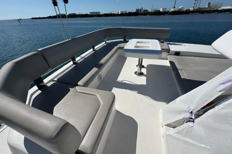 Slide: The Image of Spacious deck seating on 2021 Leopard 45 catamaran, overlooking serene waters. - 36