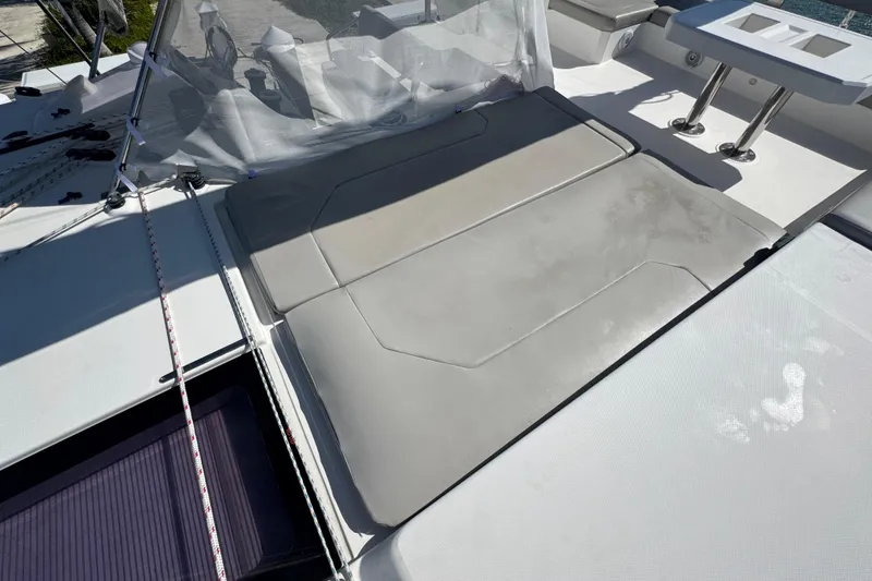 Slide: The Image of Leopard 45 catamaran deck with cushioned seating and table, 2021 model. - 40