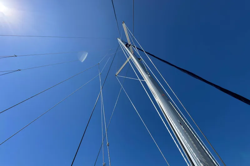 Slide: The Image of Sailboat mast and rigging against clear blue sky, Leopard 45, 2021 model. - 45