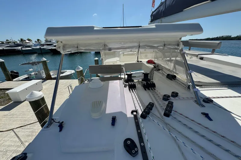 Slide: The Image of 2021 Leopard 45 catamaran deck with rigging, docked at marina. - 48