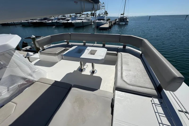 Slide: The Image of Luxurious seating area on 2021 Leopard 45 yacht, docked at marina. - 49
