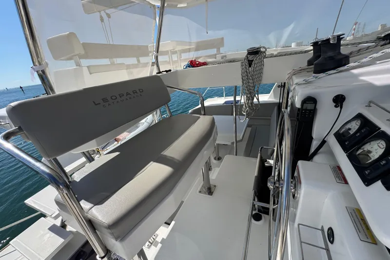Slide: The Image of Helm station of 2021 Leopard 45 catamaran with steering wheel and navigation instruments. - 55