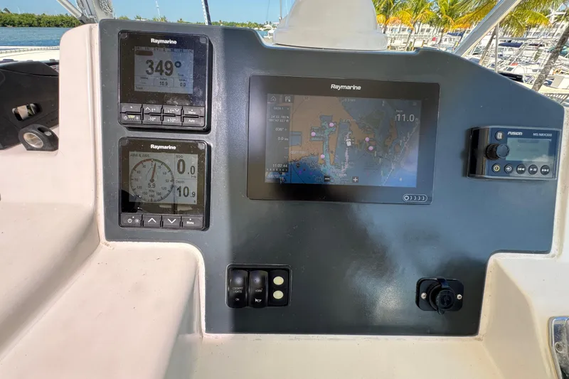 Slide: The Image of Control panel of a 2021 Leopard 45 catamaran with navigation and instrument displays. - 56